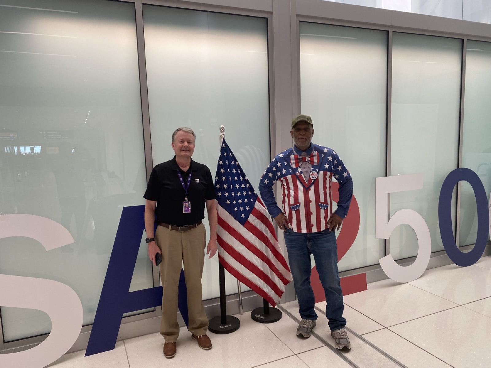 Big Tony and Chris Hock at the USA 250 display at Denver International Airport