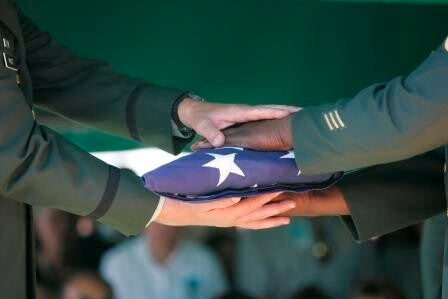 Americans holding flags during the Freedom Minute