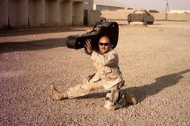 SSG Justin Vasquez with his guitar case while deployed in Iraq