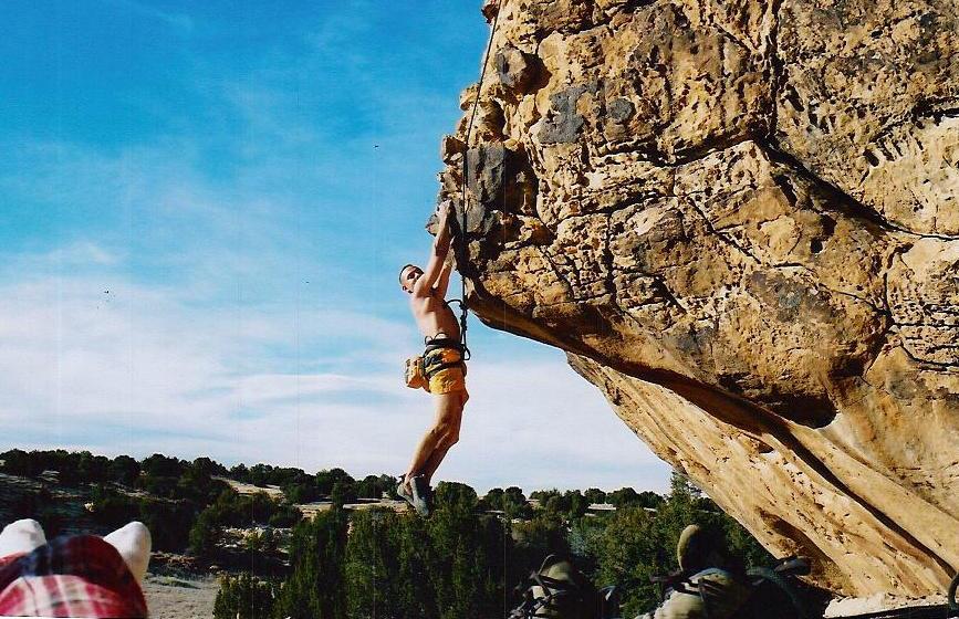 Justin Vasquez rappelling during military training